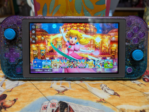 Switch lite with glitter bluebell case and princess peach theme